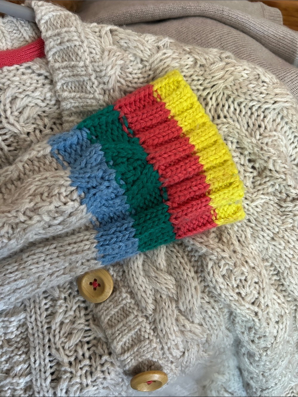 Raglan cabled three button cardigan